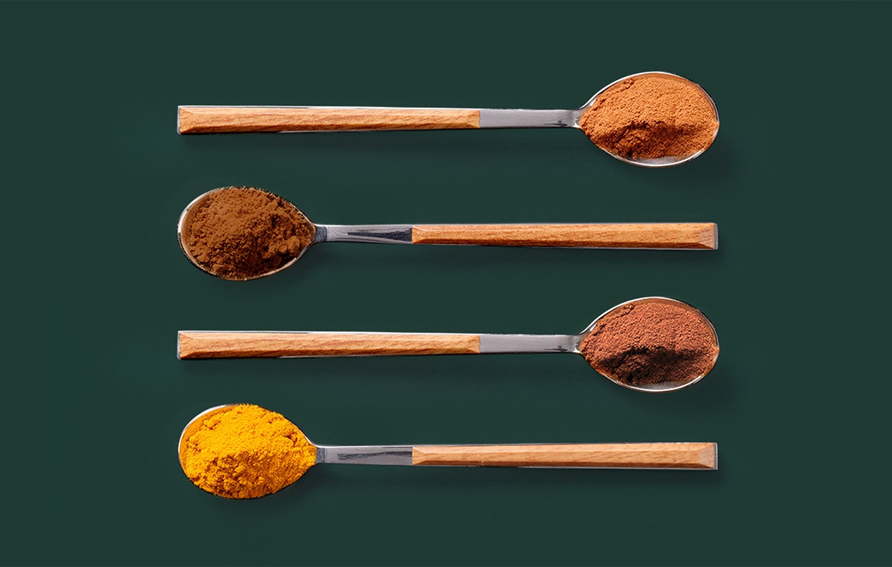 Spoons with different coffee spices